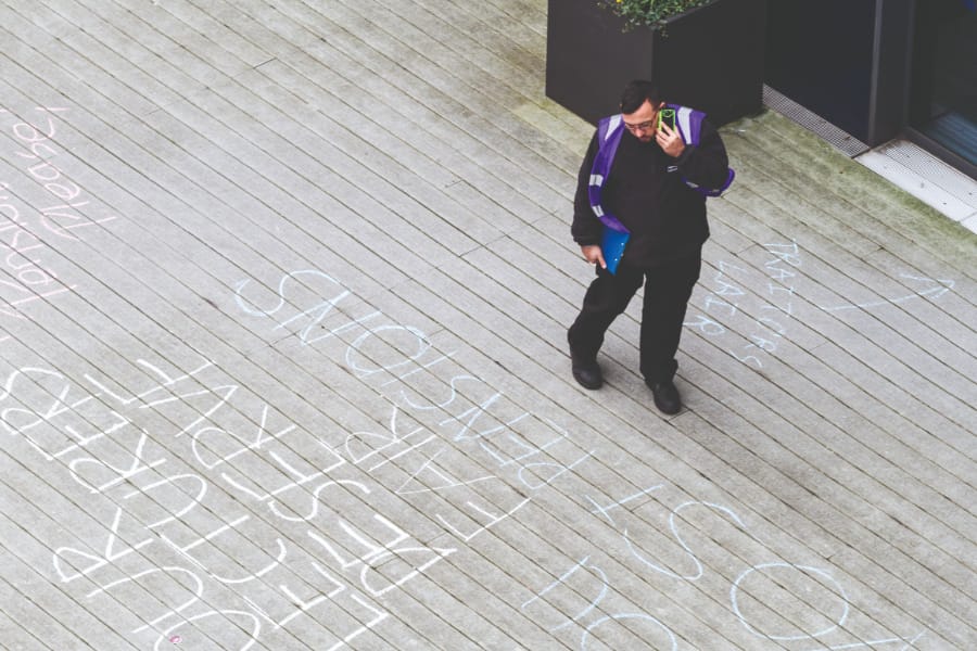 A security guard checks out the messages of support // Joseph O'Connell-Danes