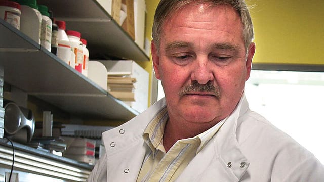 Professor Nutt looking down on those making the research laws, in a lab distincting lacking in LSD