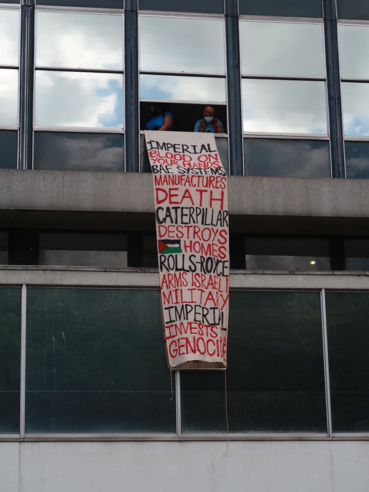 Palestine activists drop banners from windows at Exhibition Road Festival