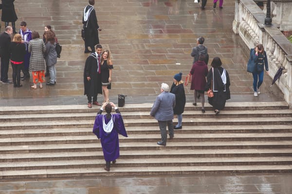 Poor weather doesn't dampen spirits at postgraduate graduation ceremony