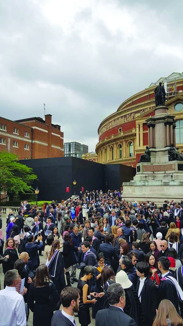 Relieved postgrads finally graduate
