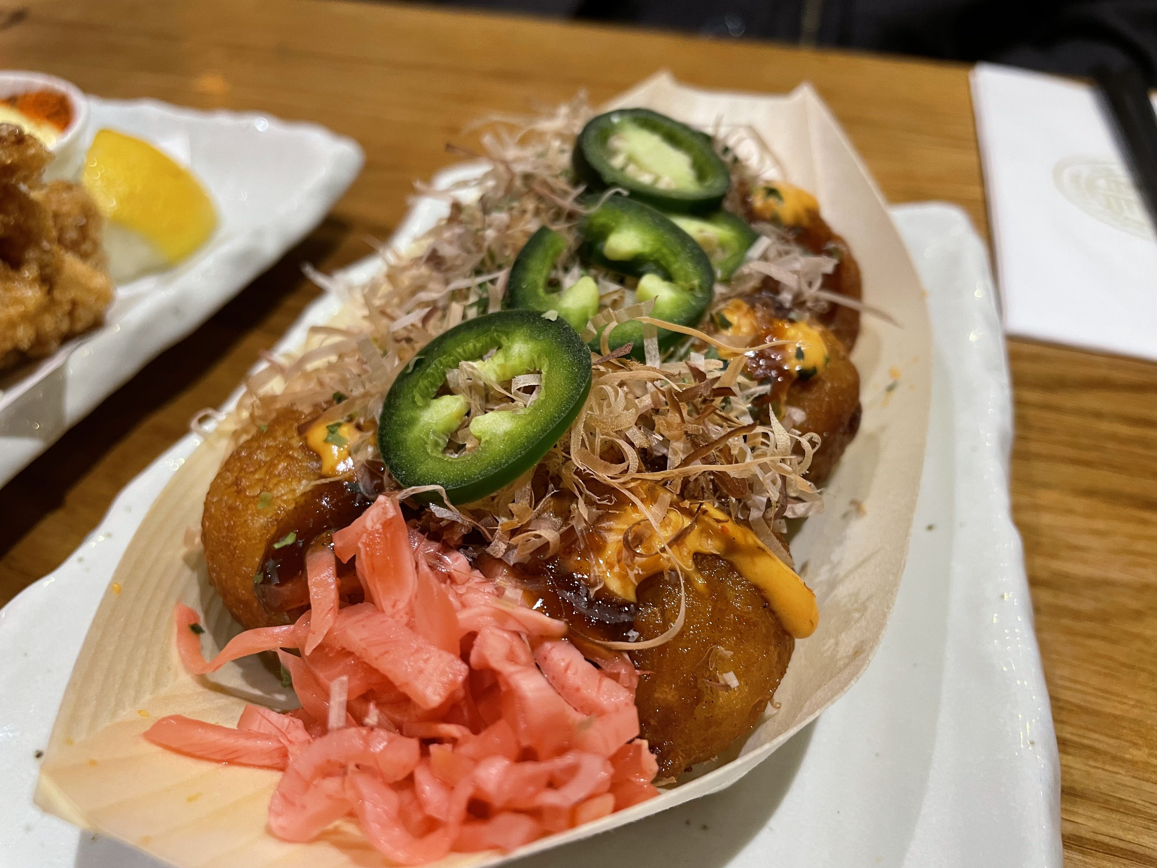 Our 8 piece Takoyaki along side some pickled ginger